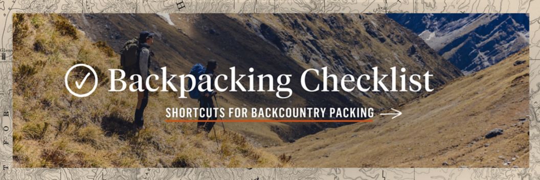 Two people wearing backpacks gaze at views in an alpine canyon. Text overlay reads: Backpacking Checklist, shortcuts for backcountry packing.